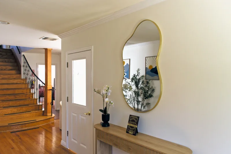 Entry console and staircase inside the Elijah's House estate